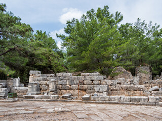 Fototapeta na wymiar Agora, ruined market square in ancient Phaselis city. Famous architectural landmark in Turkey.