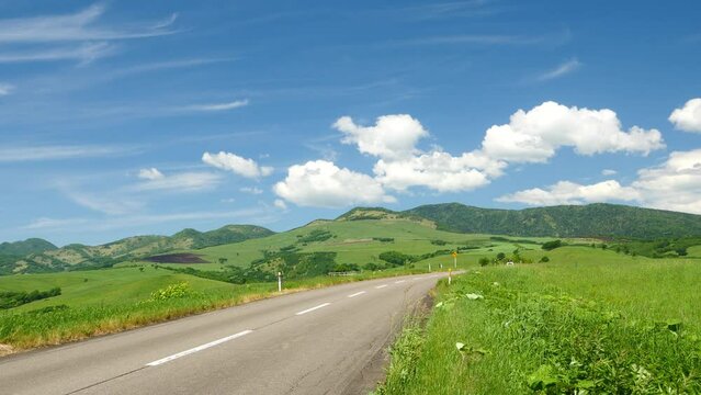 Hokkaido. A view of the blue sky and the magnificent ranch. Superb view drive.