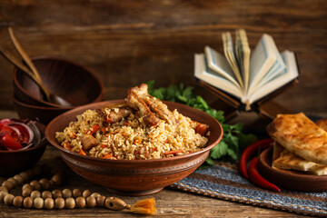 Bowl with tasty Asian pilaf on table