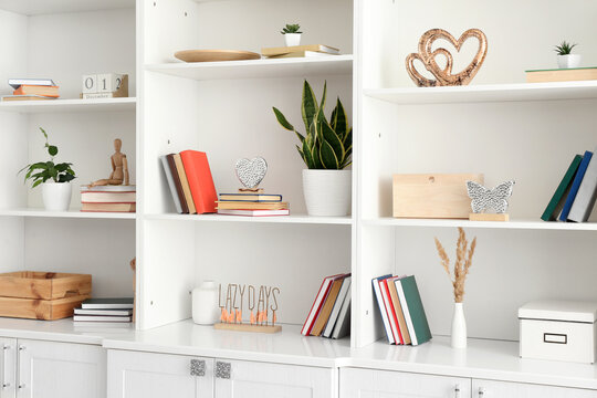 Shelf unit with beautiful decor in room