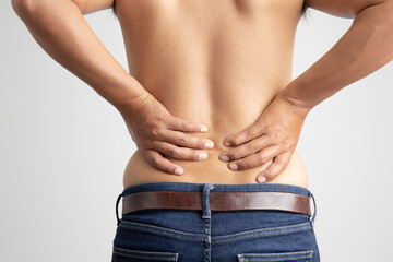 man with back pain on white background health care and medical concep