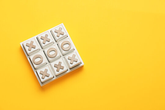 Tic-tac-toe game on orange background