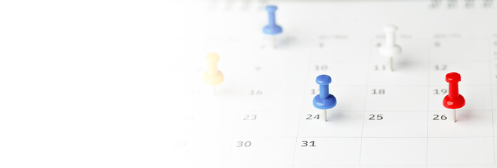 Thumbtack in calendar concept for busy, appointment and meeting reminder, planning for business meeting or travel planning concept.