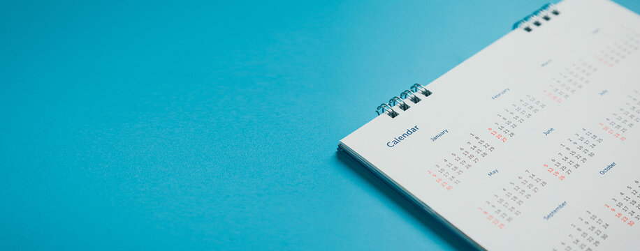 Close top view on white calendar 2022 month schedule Work planning and life concept.