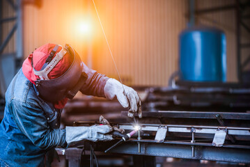 Industrial welder welding fabricated stainless construction work in factory, Welding process by Gas...