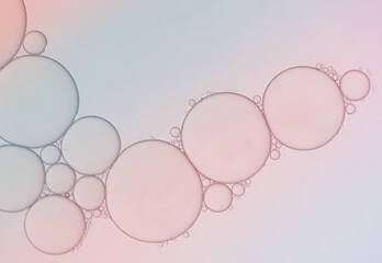 Pink gradient background with oil bubbles