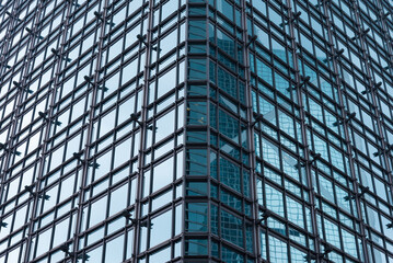 Fototapeta na wymiar Exterior mirror glass of modern office building abstract pattern background. Detail of building and architecture concept.