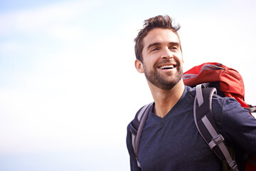 Its just better when youre outside. Shot of a young man enjoying a hike through the mountains.