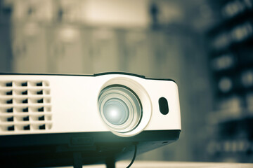 Close-up computer projector on table boardroom or meeting room technology equipment of visual or...