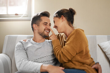 Youre all mine today. Cropped shot of a young couple relaxing on the sofa at home.