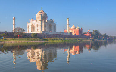 Fototapeta na wymiar Taj Mahal mausoleum reflected in Yamuna river - Agra, Uttar Pradesh, India