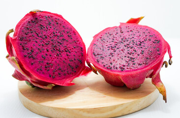 exotic tasty tropical dragon fruit on wooden plate