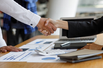 	
Business handshake for teamwork of business merger and acquisition,successful negotiate,hand shake,two businessman shake hand with partner to celebration partnership and business deal concept