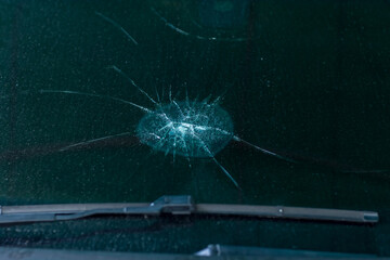 Broken car windshield .Crash windshield glass  the broken and damaged car. Tempered glass  shattered in an accident. Broken Windshield