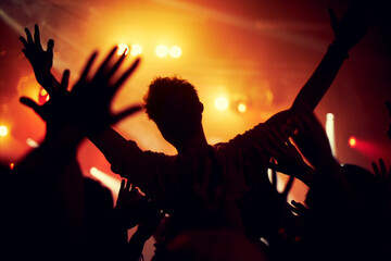 A young man crowd surfing to his favorite band. This concert was created for the sole purpose of this photo shoot, featuring 300 models and 3 live bands. All people in this shoot are model released.