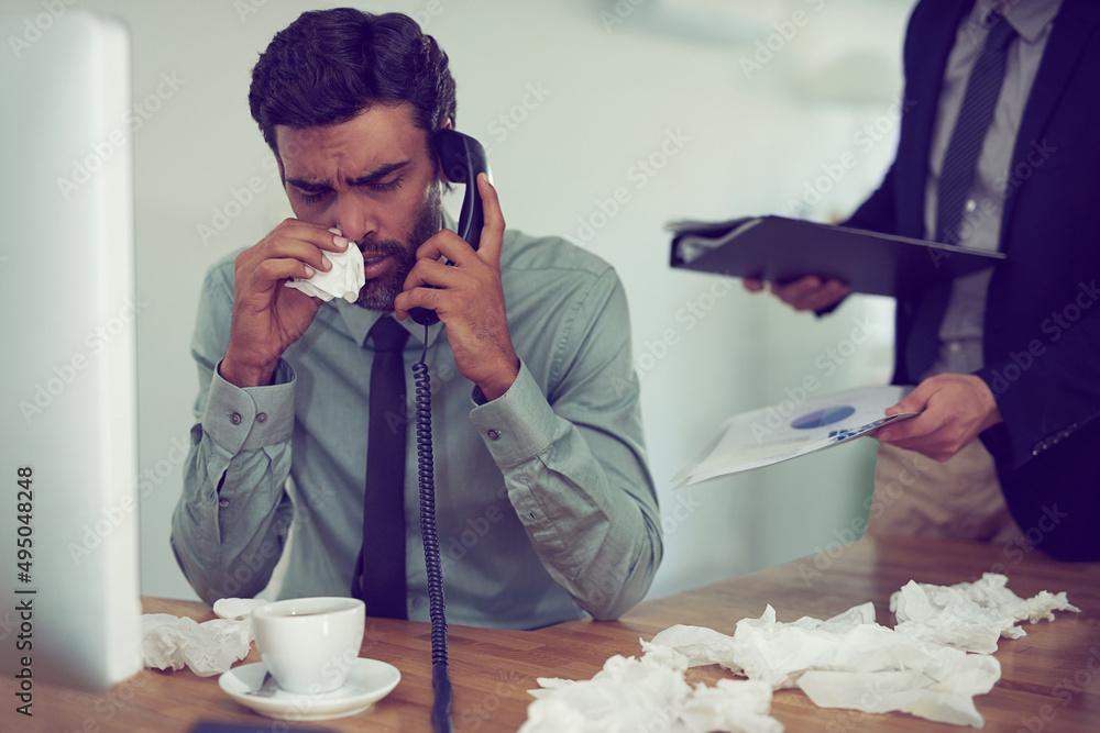 Poster He could do with a time-out from work. Cropped shot of a businessman suffering with allergies in an office.