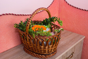 basket of Easter decorations,in the hallway on the dresser basket with Easter cake