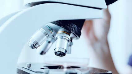 Closeup microscope laboratory, blood test running, virus check banner