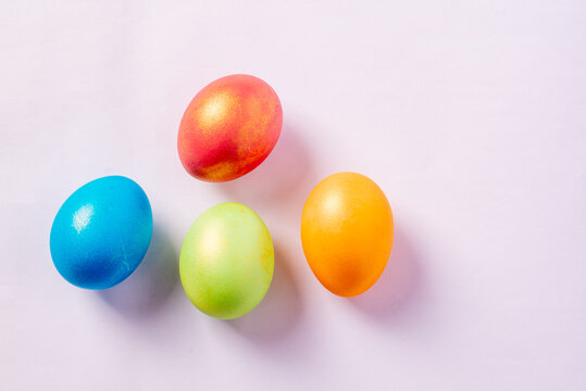 colored painted eggs on a white background. High quality photo