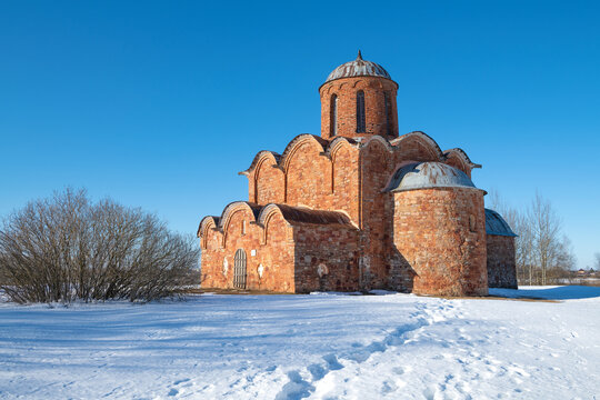 View of the old Orthodox Church of the Transfiguration of the Savior on Kovalevo on a sunny March day. Surroundings of Veliky Novgorod, Russia