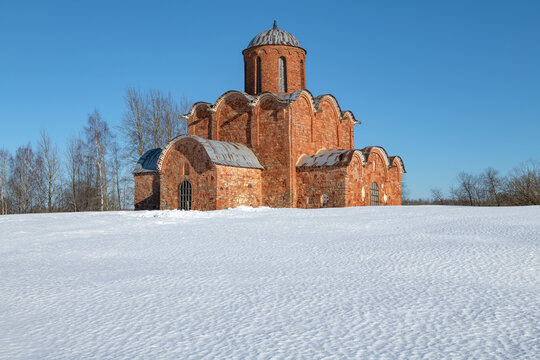 View of the medieval Church of the Transfiguration of the Savior on Kovalevo on a sunny March day. Surroundings of Veliky Novgorod, Russia
