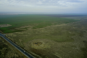 steppe landscape with expensive arable land and clouds