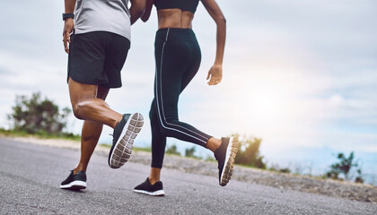 There are no limits. Closeup shot of a sporty couple exercising together outdoors.