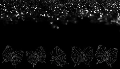 beautiful pattern of butterflies made of sequins on a black background