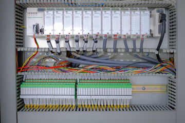 Wiring PLC Control panel with wires industrial factory.Wiring terminals in the electrical Cabinet....