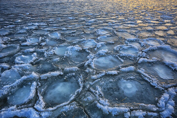 freezing sea ice round pieces, ocean background winter climate coast