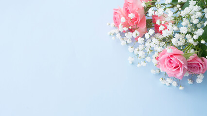 Bouquet of delicate pink roses and white gypsophila. Image with selective focus