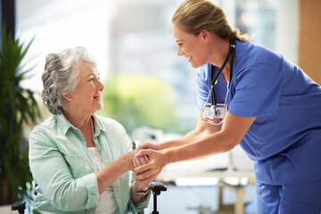 She has a great way with her patiends. Shot of a doctor shaking hands with a smiling senior woman...
