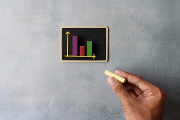 Sales graph chart on chalkboard. Business and sales analysis report concept