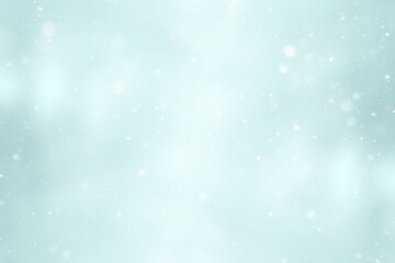 blurred snow / winter abstract background, snowflakes on abstract blurred glowing leaf background