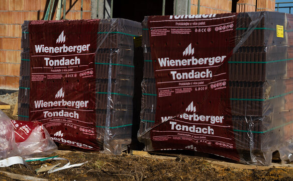 Wienerberger Tondach building material company ceramic roof tiles at construction site of a new single-family house. Unfinished stand-alone home under construction on March 8, 2022 in Krakow, Poland.