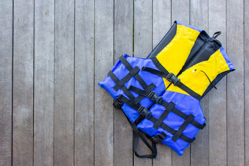 life jacket on wooden floor for product placementwith natural pattern texture.