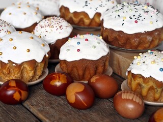 Homemade Easter cakes with eggs on a wooden background.The idea of preparing for the Easter holiday.