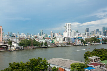Chao Phraya River include modern tower and public boat, It's the major river in Thailand