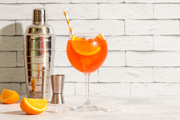 Glass of cold Aperol spritz cocktail.