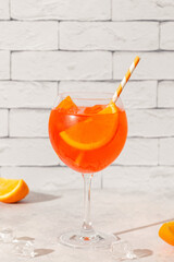 Glass of cold Aperol spritz cocktail.