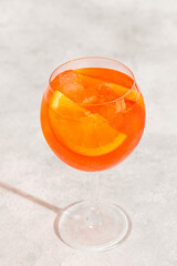 Glass of cold Aperol spritz cocktail.