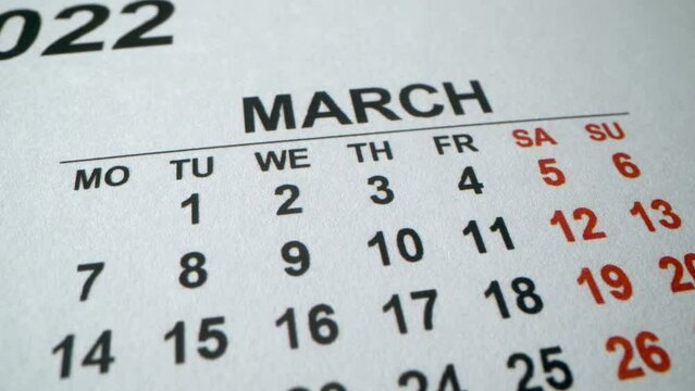 Calendar with an important event for 8 March, International Women's Day. 2022 year. Macro shot of dates in Marh. Holidays and business days in new year.