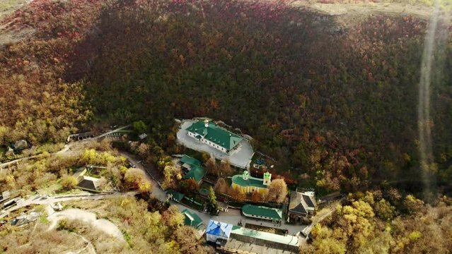 Beautiful 4K panoramic aerial video from flying drone to Orthodox Church in nature. Religion Culture with old church in Forest. Cathedral Ortodox exterior in Nature.