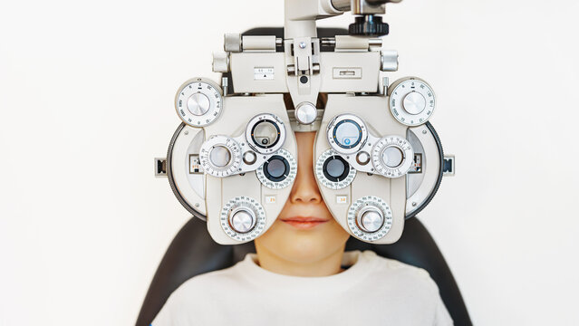 a child doing eye test in clinic