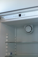 Home refrigerator with empty shelves. Lack of products.