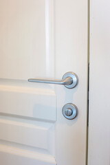 White door and silver doorknob in the apartment