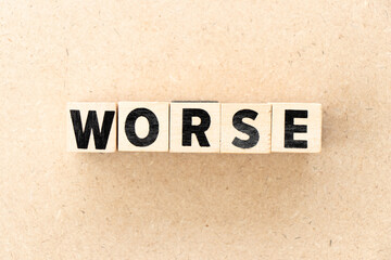 Obraz premium Alphabet letter block in word worse on wood background