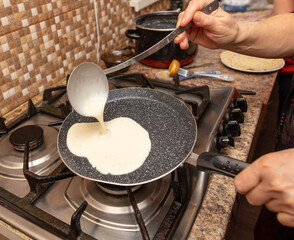 Pancakes from liquid dough are fried