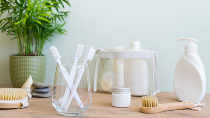 View of personal hygiene items and bottles of cosmetics in the bathroom