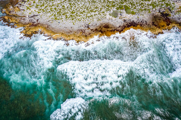 Beach and waves from top view. Turquoise water background from top view. Summer seascape from air. Top view from drone. Travel concept and idea